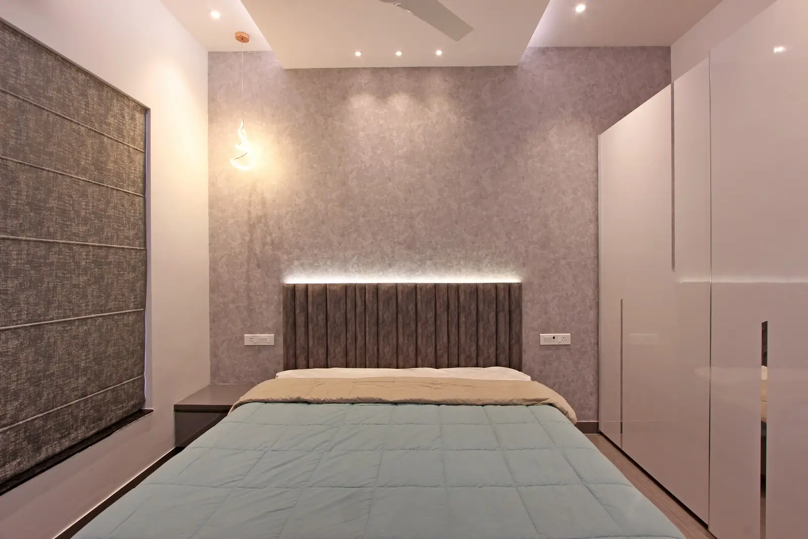 A minimalist aesthetic is achieved through clean lines, neutral colors, and a refined material palette, creating a calming and elegant atmosphere.
