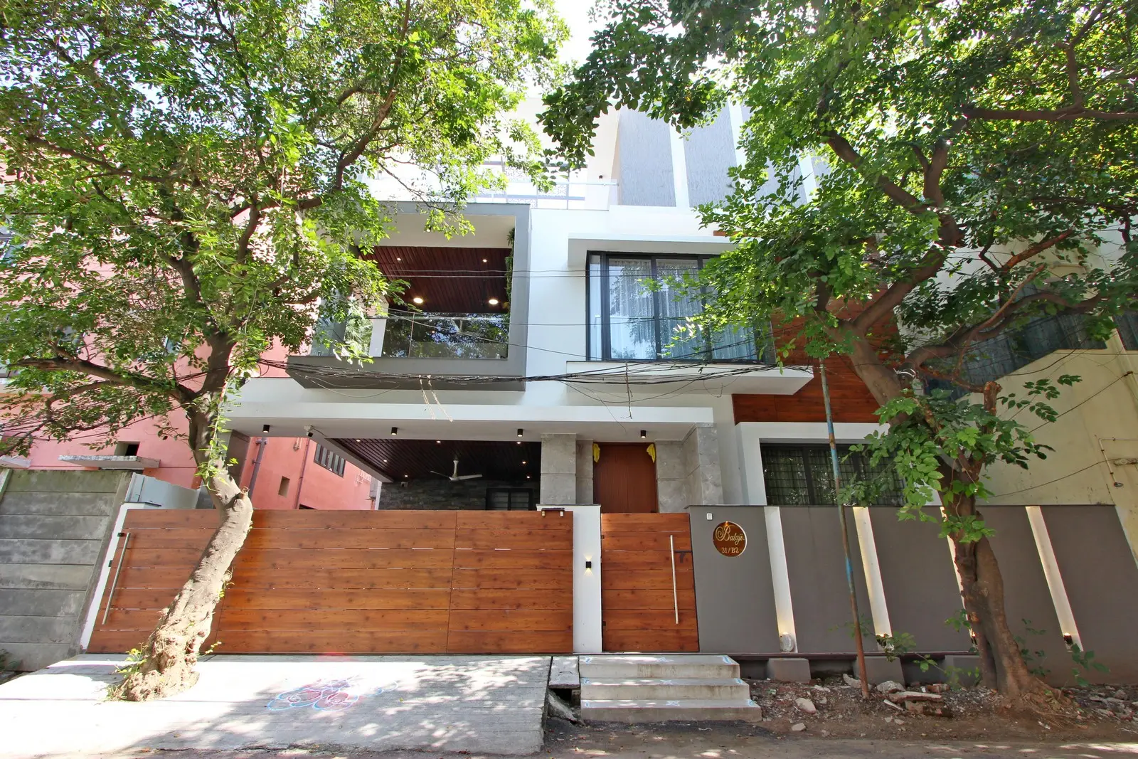 Ground Floor - this elegant contemporary residence features a striking façade with warm lighting, sleek glass elements, and refined wooden finishes, creating a luxurious modern appeal.
