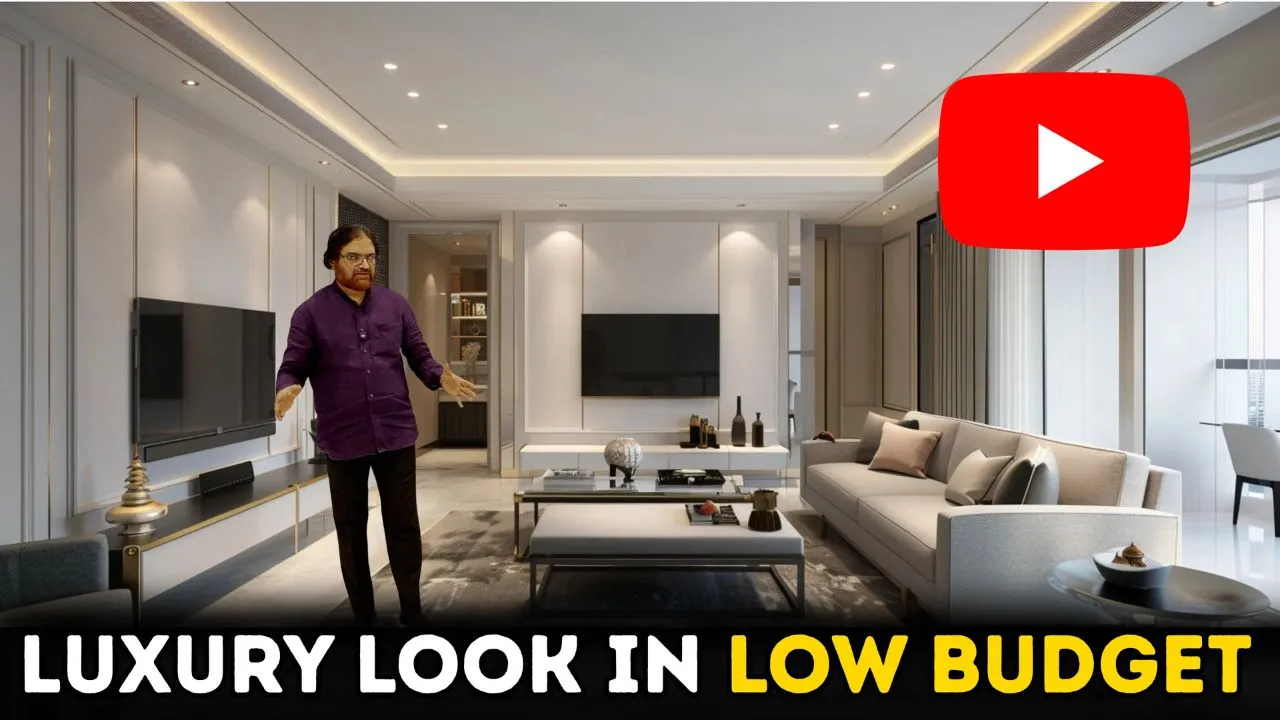 Man standing in a modern, stylish living room with a large sofa, coffee table, and wall-mounted TV, with text "LUXURY LOOK IN LOW BUDGET" and a red YouTube play button symbol in the top right corner.
