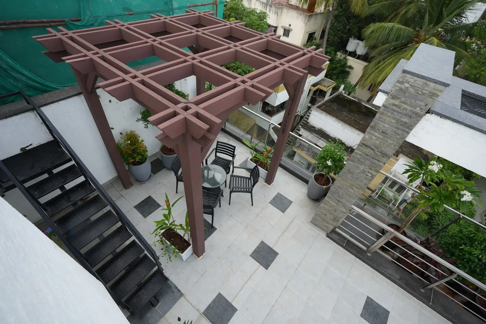 Blending luxury with comfort, the terrace features sunbathing spaces, accent lighting, glass elements, practical access, and a serene, inviting outdoor ambiance for ultimate relaxation.
